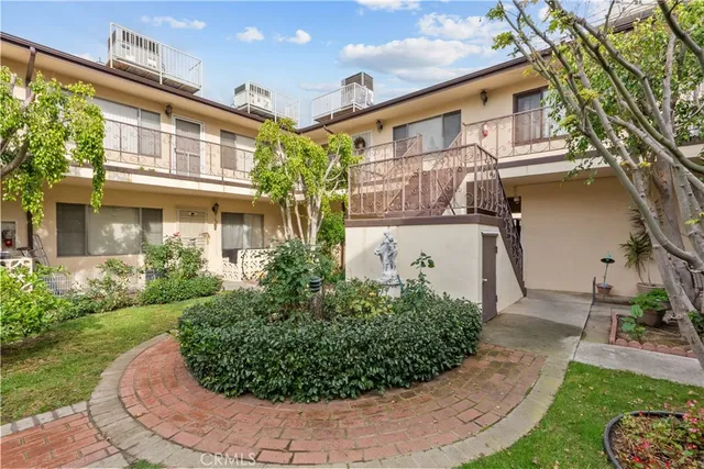 front view of a house with a garden