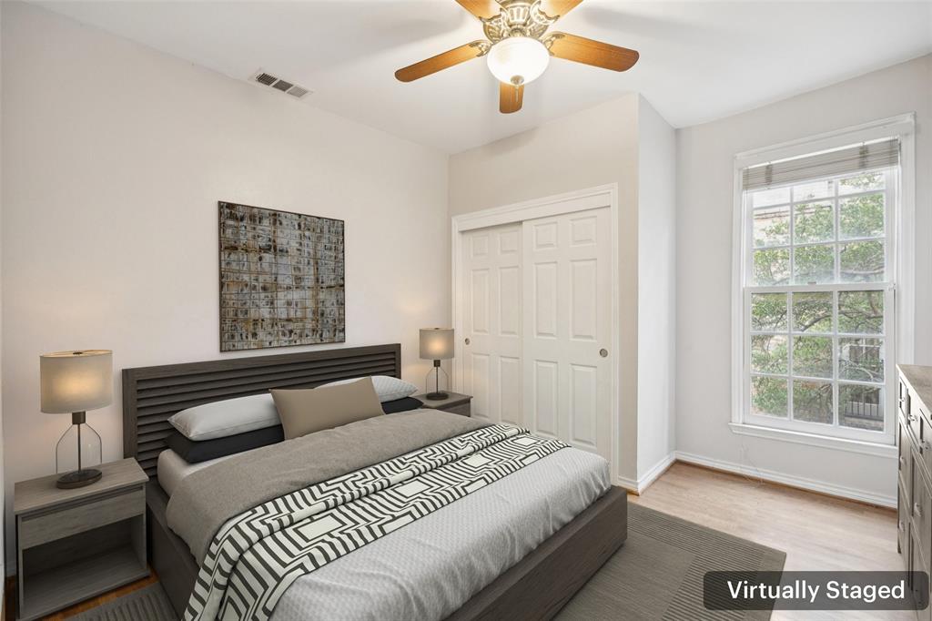 4511 Gilbert Avenue, Unit 103 Dallas, TX 75219 - Photo 16 of 35 a bedroom with a large bed and a window