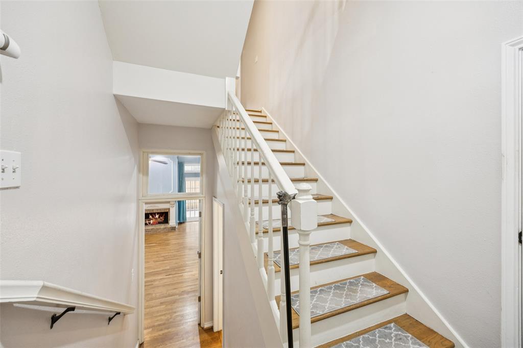 4511 Gilbert Avenue, Unit 103 Dallas, TX 75219 - Photo 22 of 35 a view of a hallway with staircase