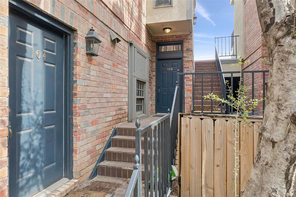 4511 Gilbert Avenue, Unit 103 Dallas, TX 75219 - Photo 28 of 35 a view of a brick house with many windows