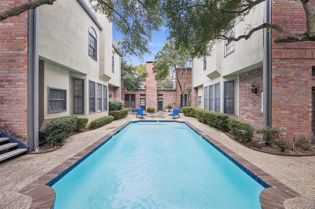 4511 Gilbert Avenue, Unit 103 Dallas, TX 75219 - Photo 31 of 35 a view of a patio with swimming pool