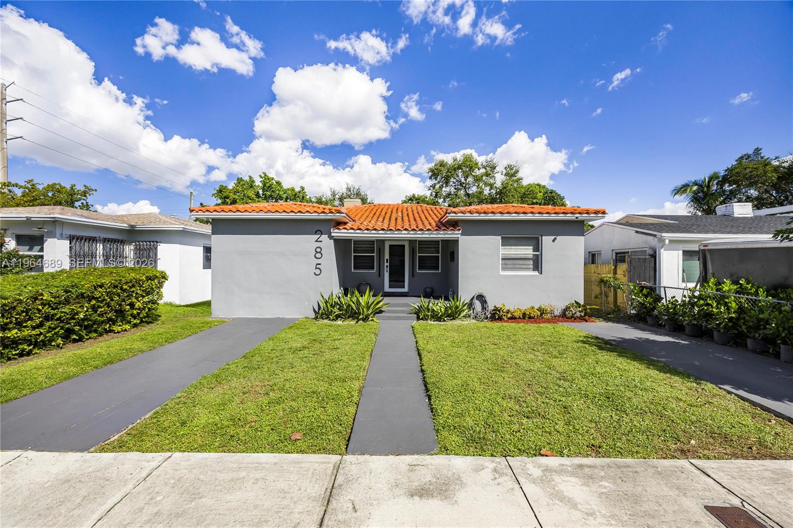 285 Northwest 45th Street Miami, FL 33127 - Photo 1 of 39 front view of a house with a yard