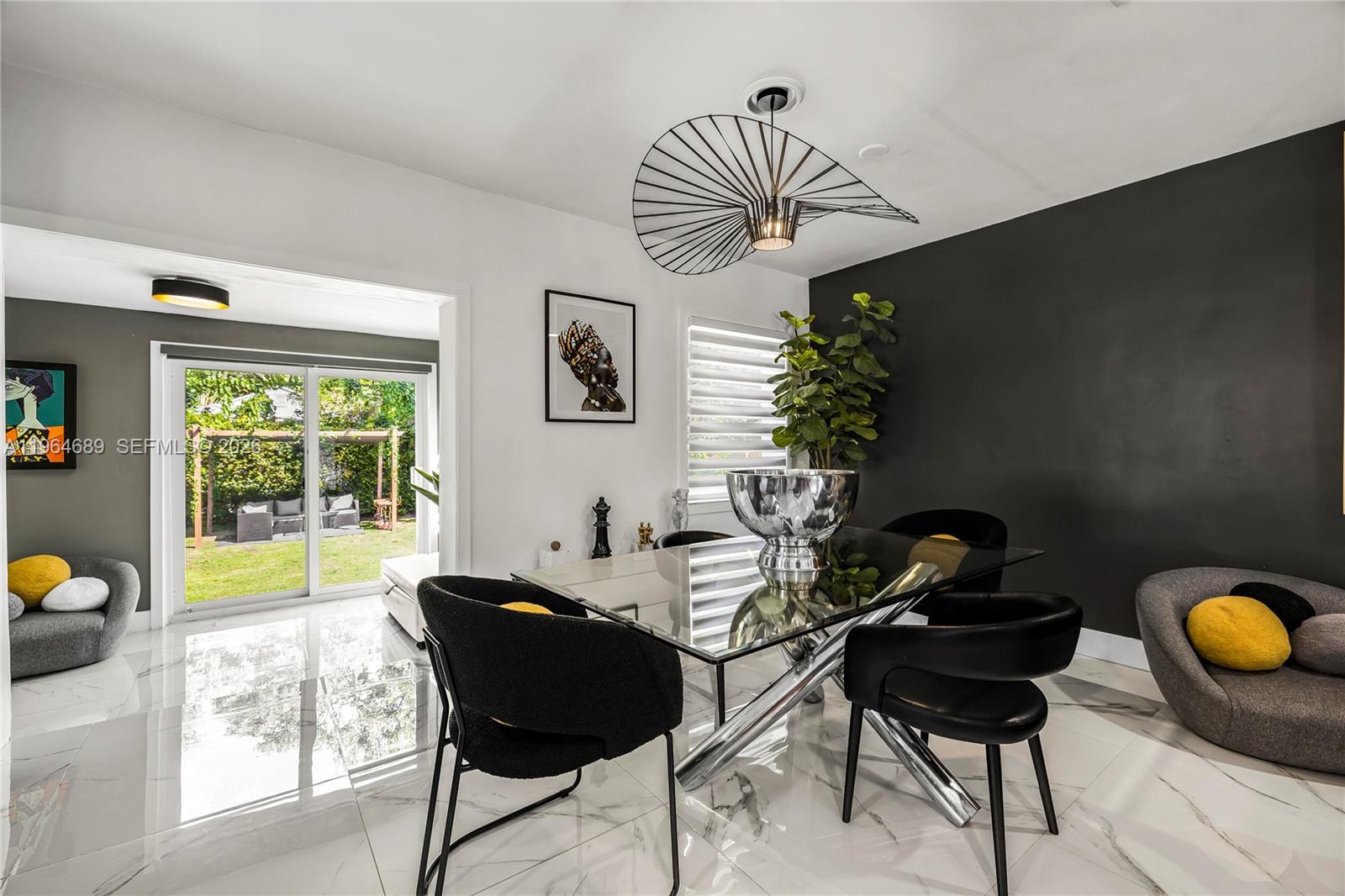 285 Northwest 45th Street Miami, FL 33127 - Photo 11 of 39 a living room with furniture and a large window