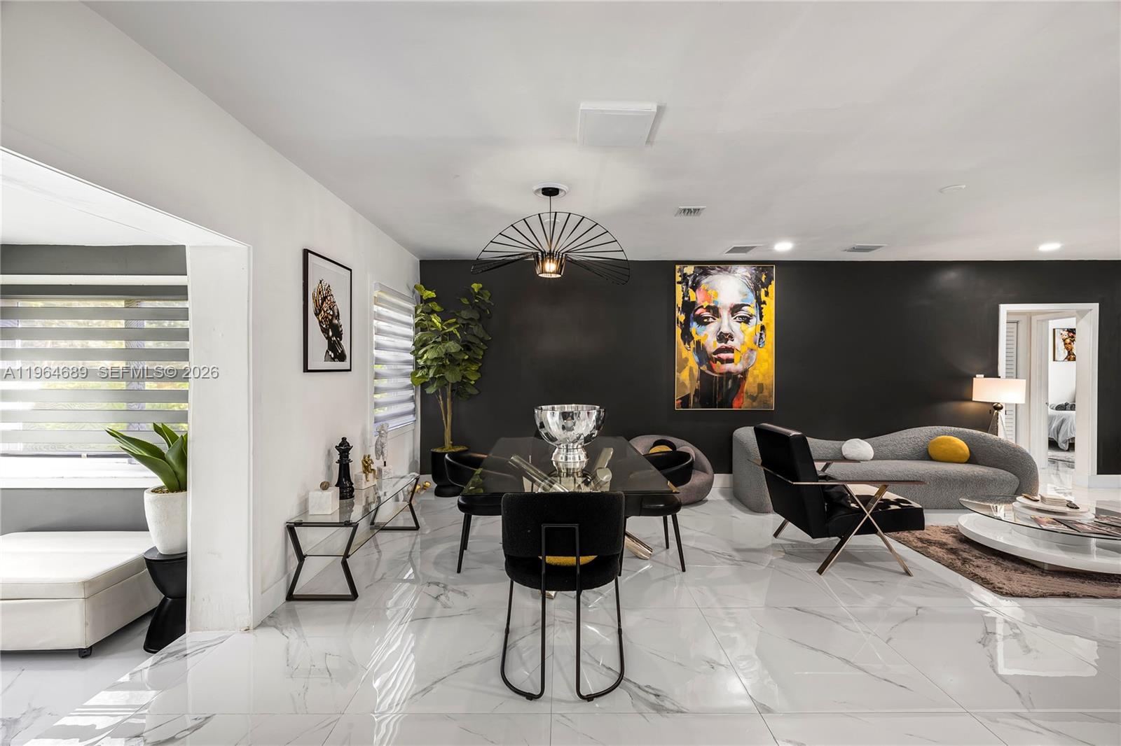 285 Northwest 45th Street Miami, FL 33127 - Photo 12 of 39 a living room with furniture and wooden floor