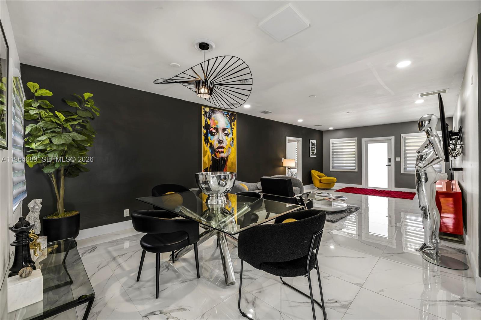 285 Northwest 45th Street Miami, FL 33127 - Photo 14 of 39 a living room with furniture and a potted plant