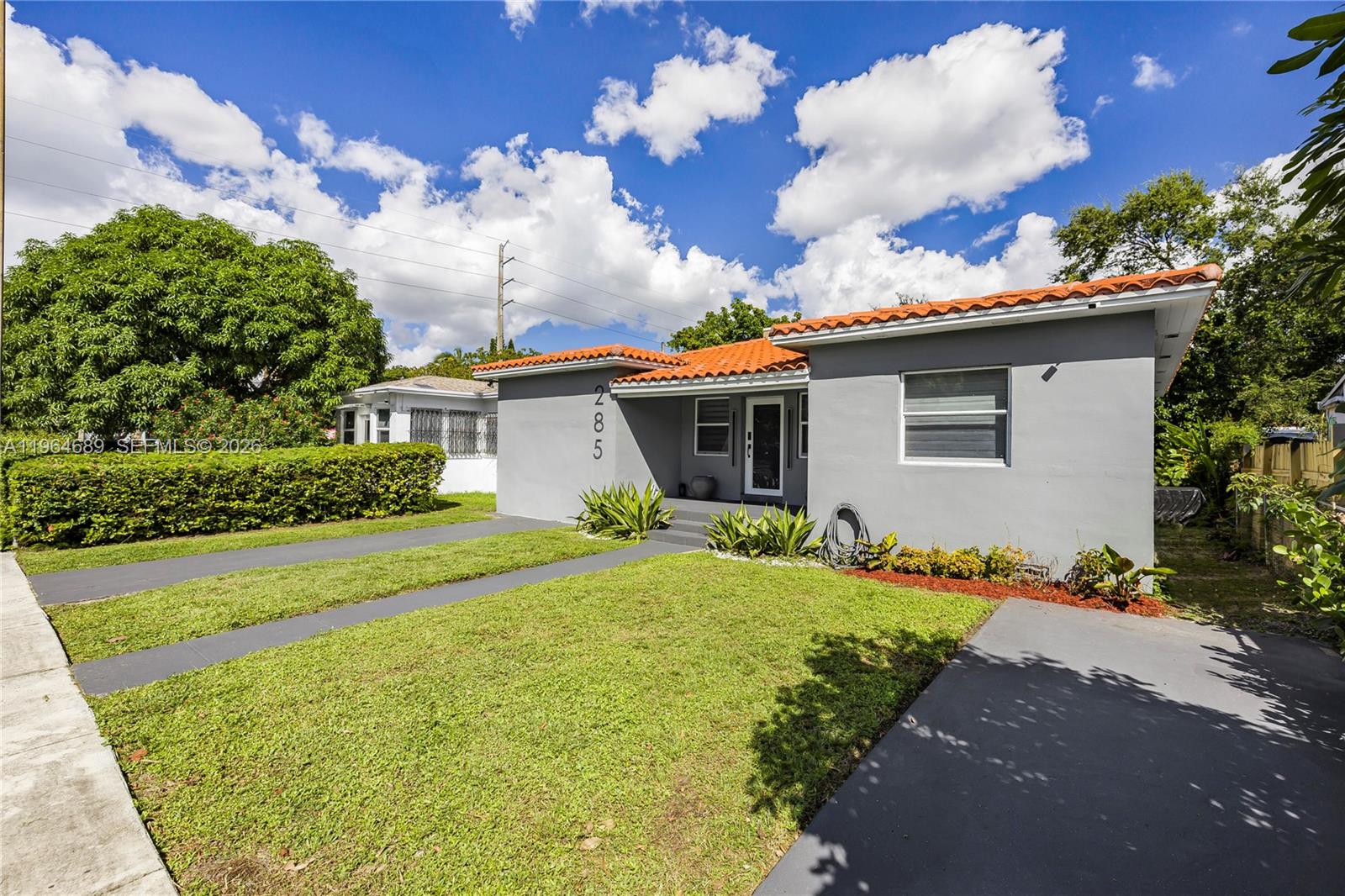 285 Northwest 45th Street Miami, FL 33127 - Photo 2 of 39 a view of a house with a backyard