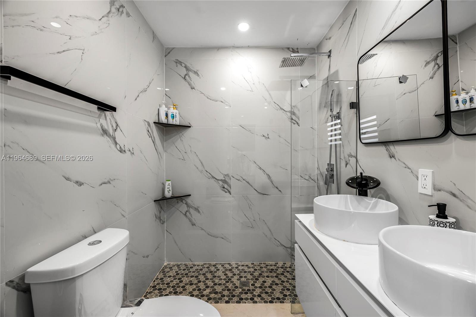 285 Northwest 45th Street Miami, FL 33127 - Photo 23 of 39 a bathroom with a sink toilet and shower