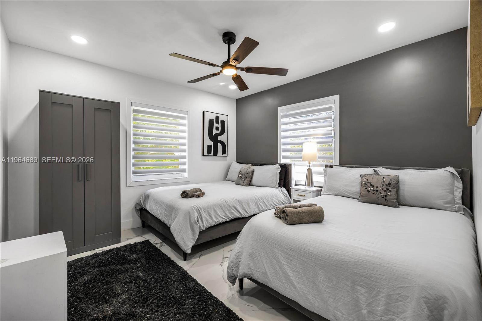 285 Northwest 45th Street Miami, FL 33127 - Photo 26 of 39 a bedroom with double bed and a window