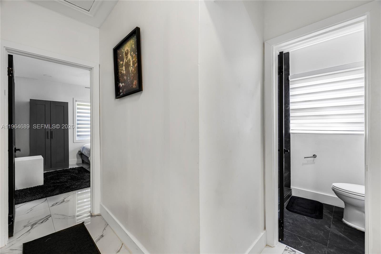 285 Northwest 45th Street Miami, FL 33127 - Photo 27 of 39 a bathroom with a toilet and a sink