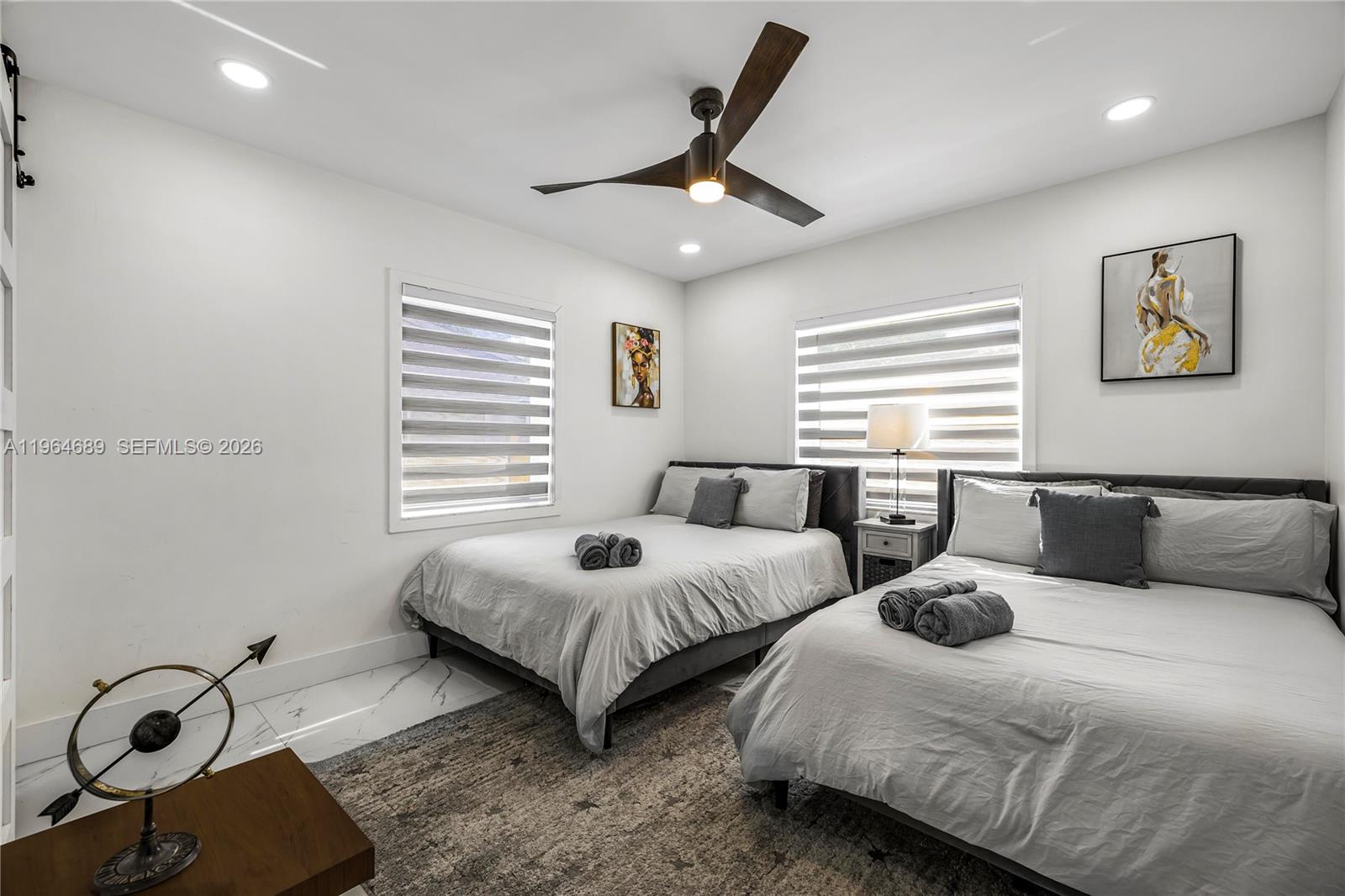 285 Northwest 45th Street Miami, FL 33127 - Photo 29 of 39 a bedroom with two beds and a window