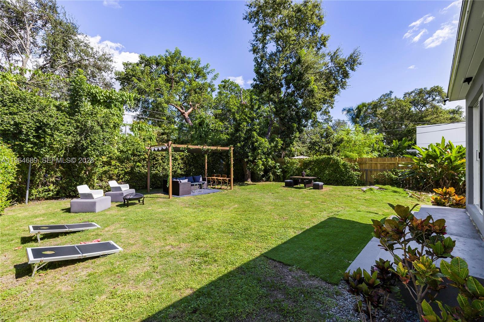 285 Northwest 45th Street Miami, FL 33127 - Photo 34 of 39 a view of a backyard with sitting area