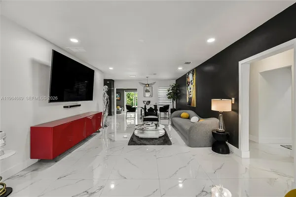a living room with furniture and a flat screen tv