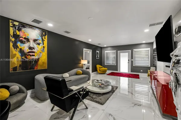 a living room with furniture and a flat screen tv