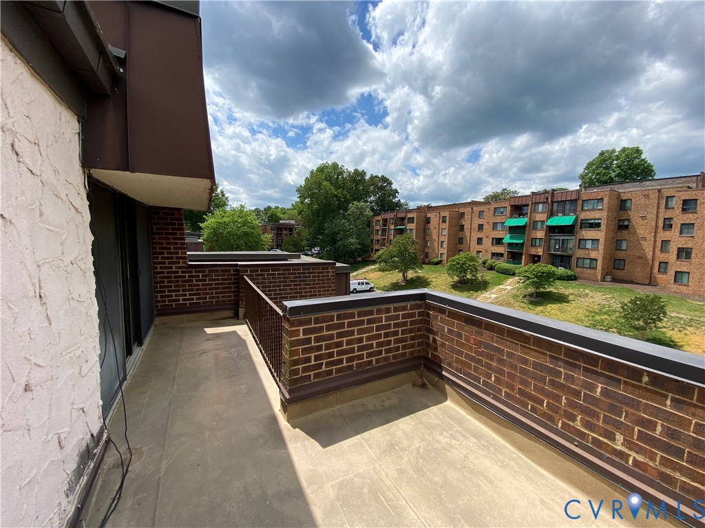 1507 Bronwyn Road, Unit 301 Henrico, VA 23238 - Photo 39 of 41 a view of balcony with wooden floor and fence and trees