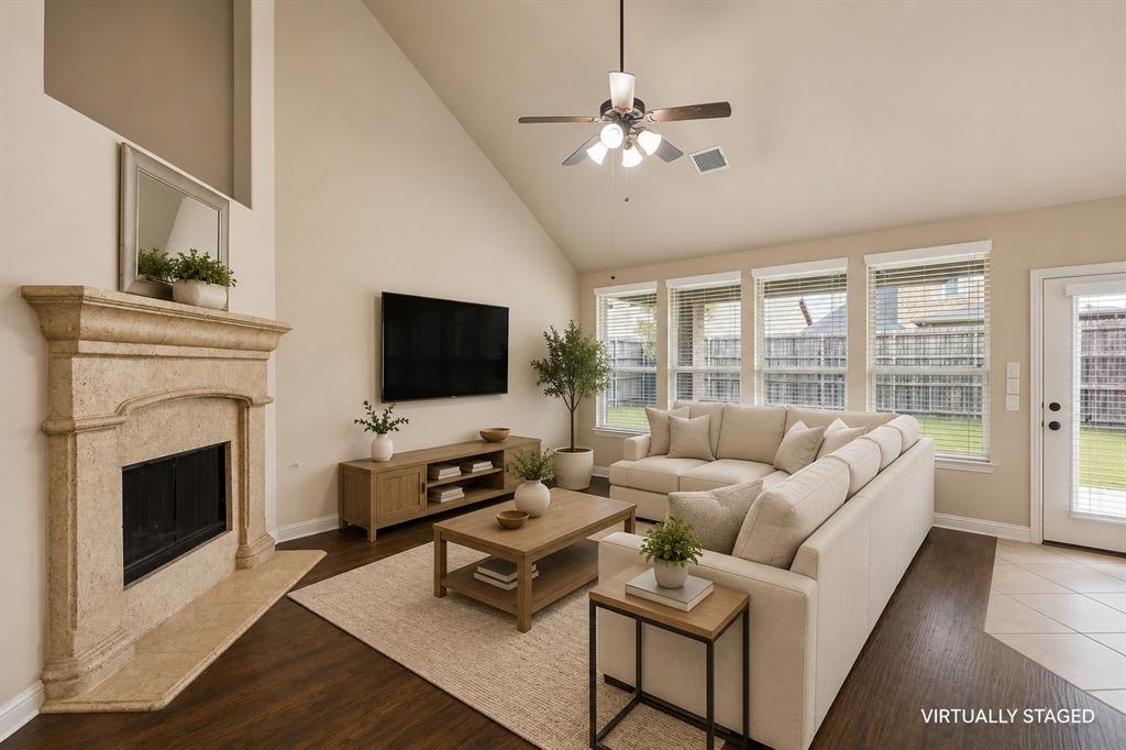 1014 Dunhill Lane Forney, TX 75126 - Photo 7 of 38 Another view of the living area with gas fire place.