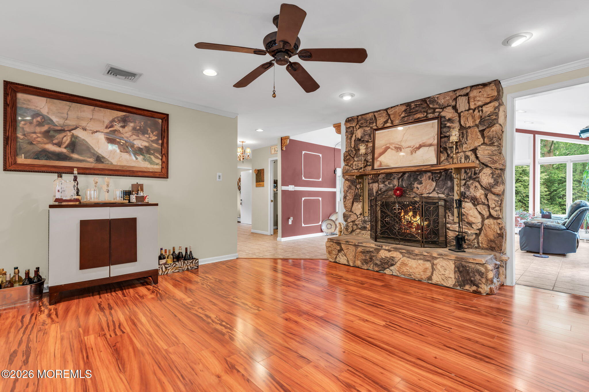 8 Owens Road Marlboro, NJ 07746 - Photo 11 of 39 a living room with furniture and a fireplace