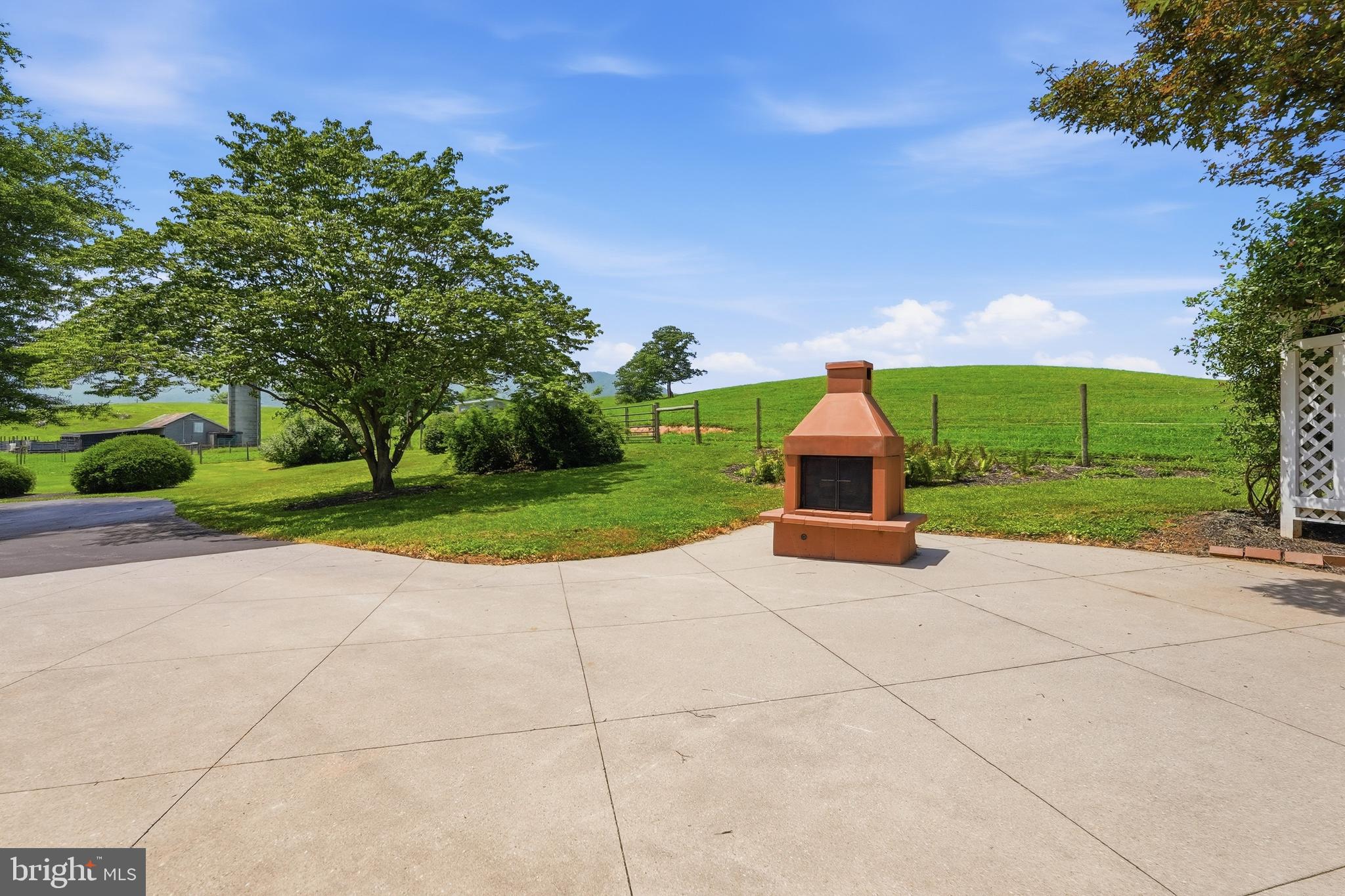 6117 South F T Valley Road Etlan, VA 22719 - Photo 23 of 36 Large, paved patio outside the sunroom