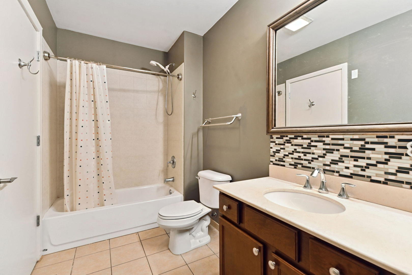 342 River Street, Unit 3402 Lemont, IL 60439 - Photo 11 of 25 a bathroom with a sink a toilet and shower