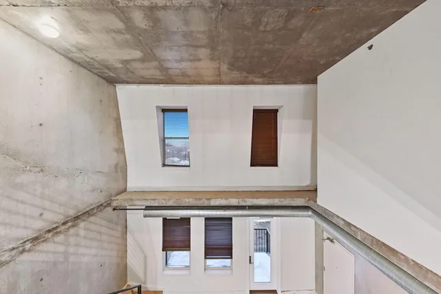 a view of a hallway with staircase