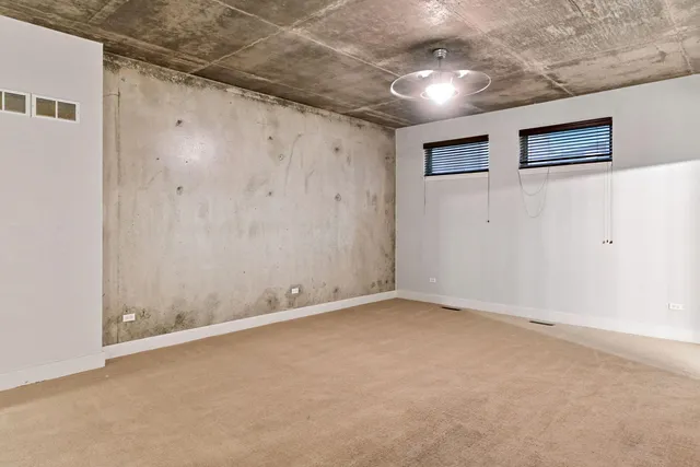 a view of a livingroom with a refrigerator