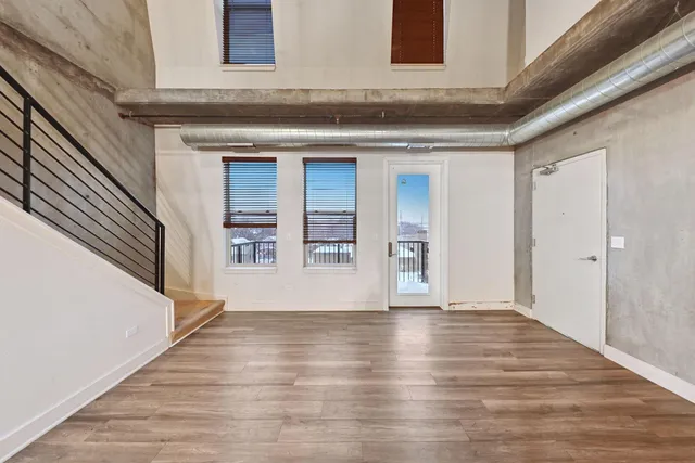 a kitchen with stainless steel appliances granite countertop a stove and a wooden floors