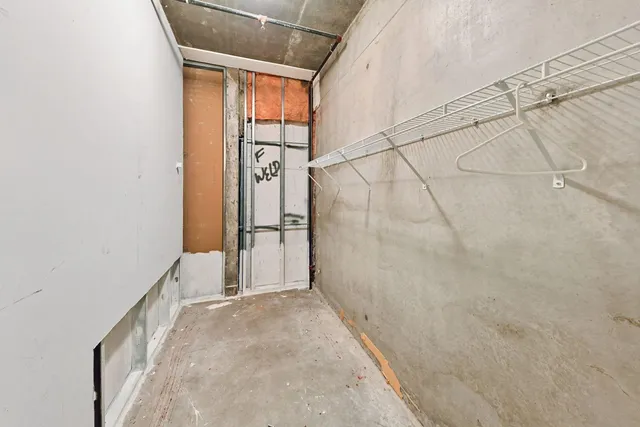 a view of a hallway with washer and dryer