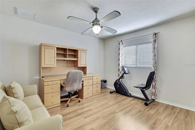 a work room with furniture and gym equipment