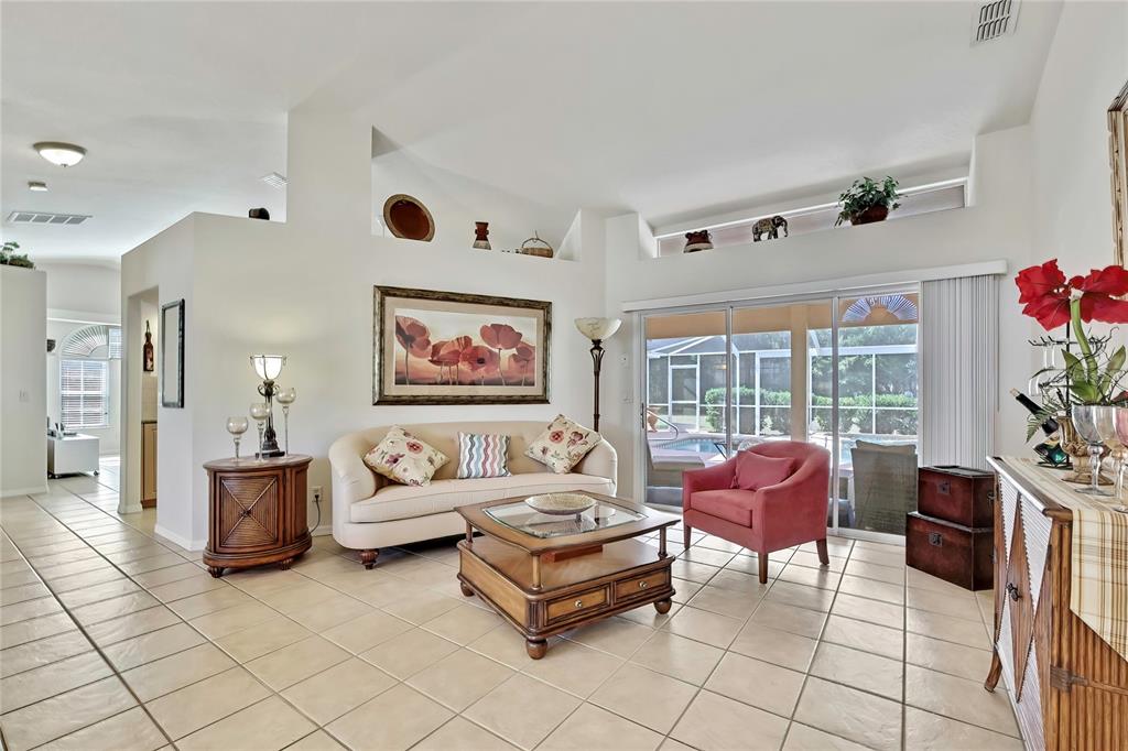3786 South Emma Jane Terrace Homosassa, FL 34448 - Photo 2 of 32 a living room with furniture and a flat screen tv