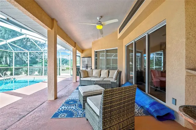 a living room with couch and a garden