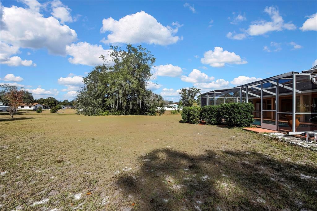 3786 South Emma Jane Terrace Homosassa, FL 34448 - Photo 28 of 32 a view of a house with a yard and lake view