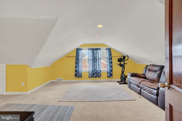 a bedroom with a bed and dresser