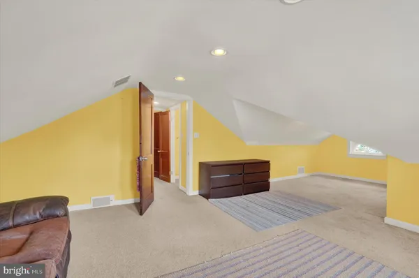 a bedroom with a bed and dresser