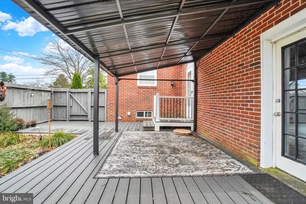 a view of a backyard with a wooden deck