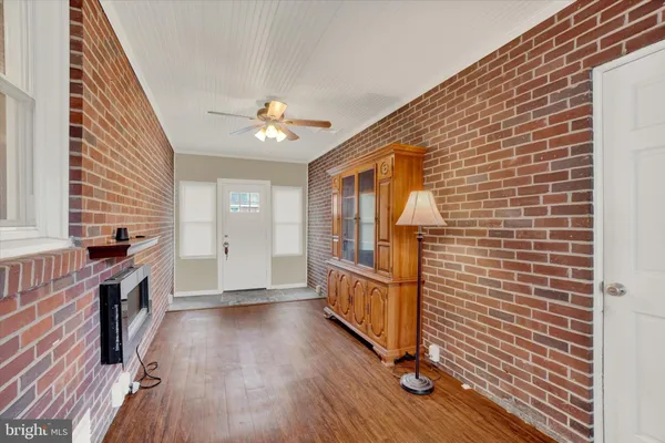 a view of entryway with wooden floor