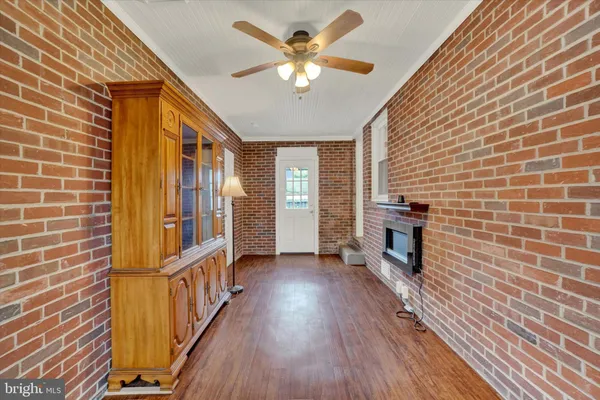 a view of an entryway with wooden floor