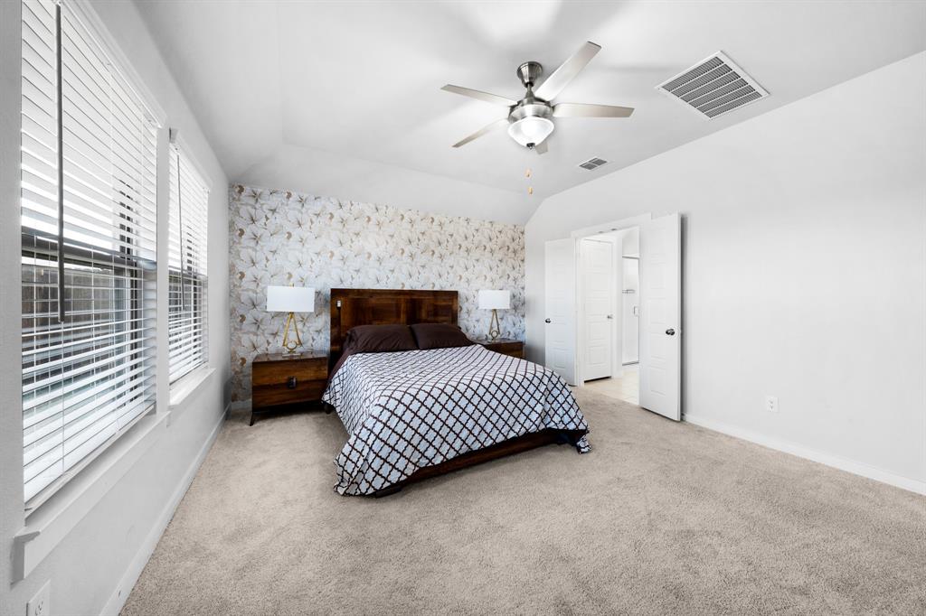 1012 Breezy Street Princeton, TX 75407 - Photo 11 of 34 a bedroom with a bed and window