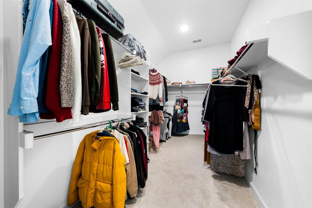 1012 Breezy Street Princeton, TX 75407 - Photo 15 of 34 a view of walk in closet with clothes and shoes
