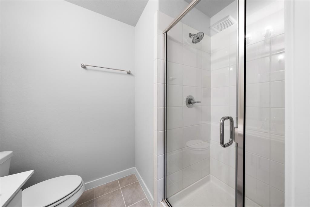 1012 Breezy Street Princeton, TX 75407 - Photo 22 of 34 a bathroom with a shower and toilet