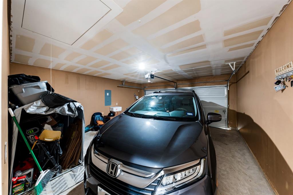 1012 Breezy Street Princeton, TX 75407 - Photo 23 of 34 a car parked in a garage