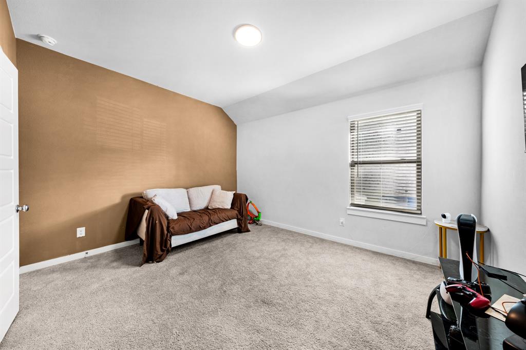 1012 Breezy Street Princeton, TX 75407 - Photo 24 of 34 a bedroom with a bed and a window