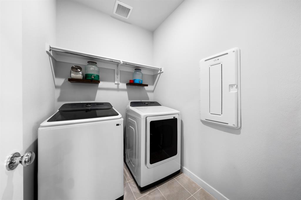 1012 Breezy Street Princeton, TX 75407 - Photo 25 of 34 a utility room with dryer and washer