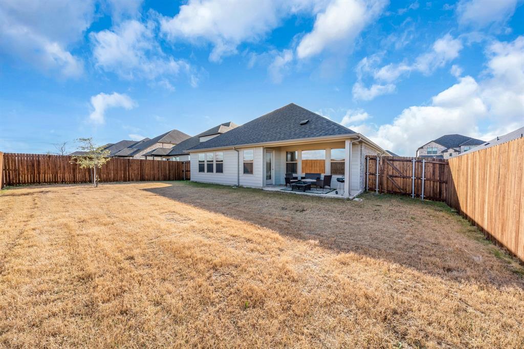 1012 Breezy Street Princeton, TX 75407 - Photo 27 of 34 a front view of a house with a yard