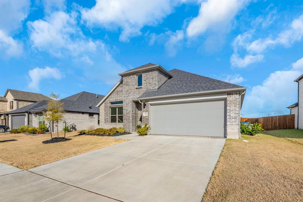 1012 Breezy Street Princeton, TX 75407 - Photo 29 of 34 a front view of a house with a yard