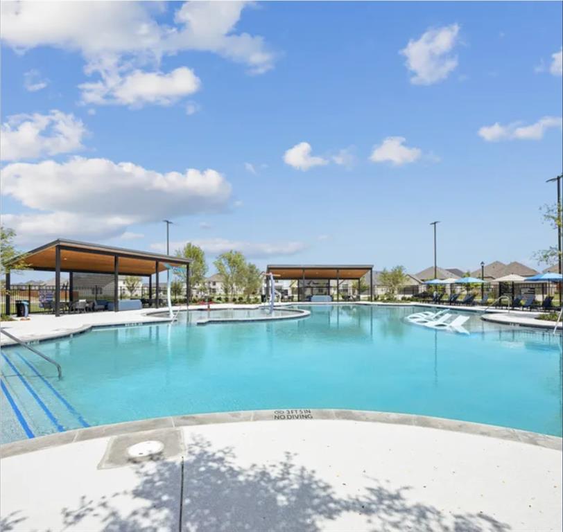 1012 Breezy Street Princeton, TX 75407 - Photo 33 of 34 a view of a lake with houses