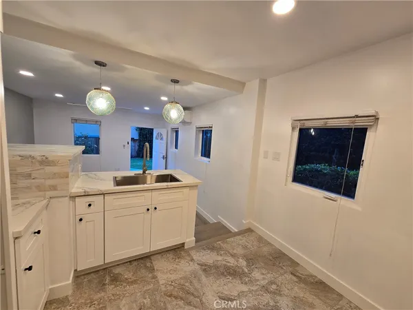 a spacious bathroom with a double vanity sink and a mirror