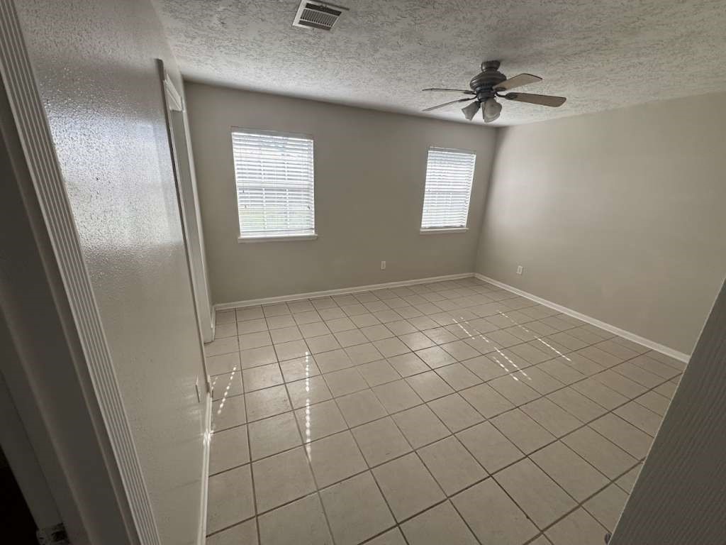 3 John Kay Road Huntsville, TX 77320 - Photo 16 of 22 a view of an empty room and window