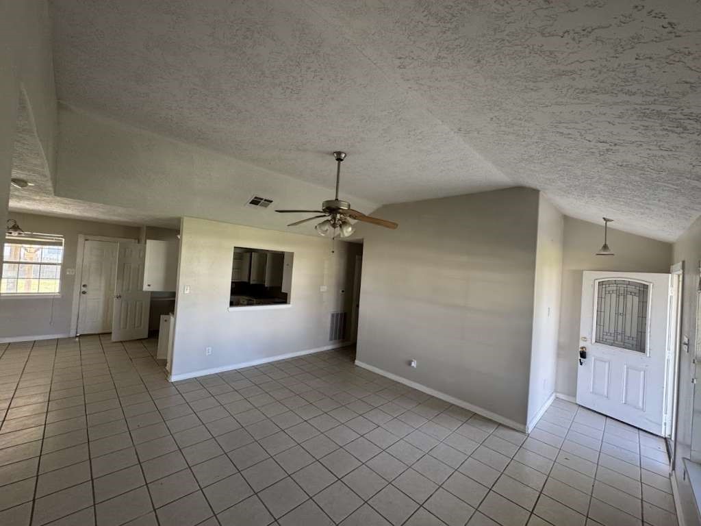 3 John Kay Road Huntsville, TX 77320 - Photo 3 of 22 an empty room with fan and windows