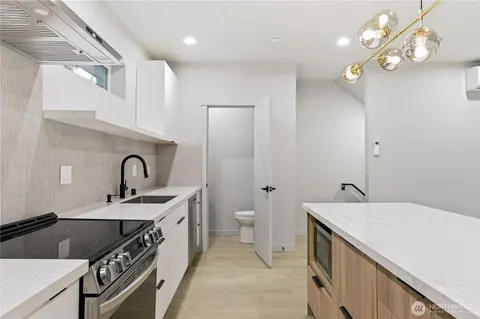 a spacious bathroom with a double vanity sink and a mirror