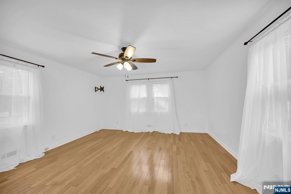 3 Country Club Road Livingston, NJ 07039 - Photo 17 of 37 a view of empty room with wooden floor and fan