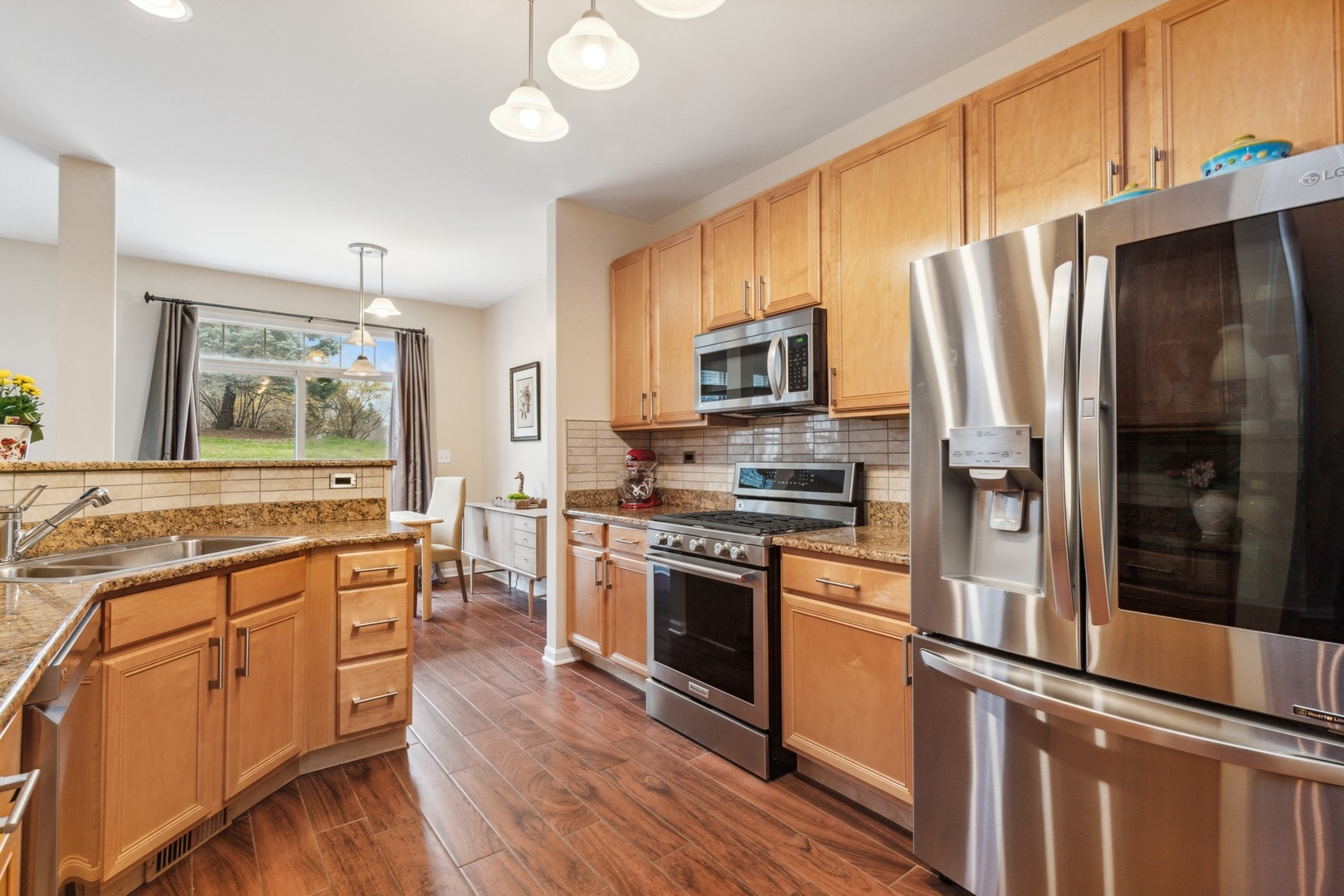 480 Pine Lake Circle Vernon Hills, IL 60061 - Photo 5 of 15 a kitchen with stainless steel appliances a refrigerator a stove top oven and sink